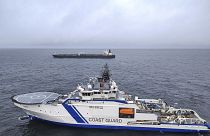 The oil tanker Eagle S, background, and the Finnish Border Guard ship Turva at sea outside Porkkalanniemi, 26 December, 2024