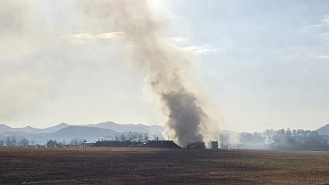 Firefighters work to extinguish a fire off the runway of Muan International Airport in South Korea, 29 December, 2024
