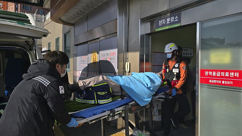 A passenger rescued from the Muan plane crash is transported to a hospital in Mokpo, 29 December, 2024