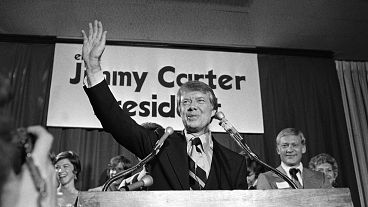 Georgia Governor Jimmy Carter waves to a crowd gathered after he announced he is a Democratic candidate for the presidency, 12 December, 1974