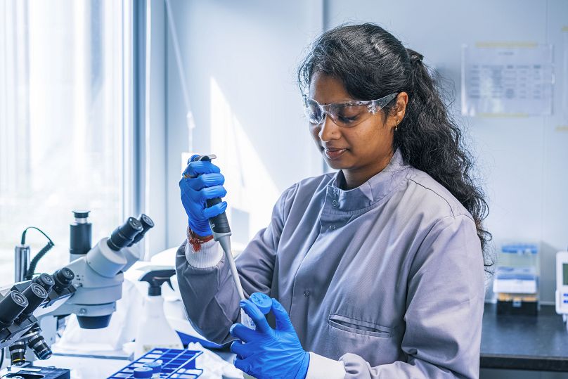 A MiAlgae scientist works in their on-site laboratory