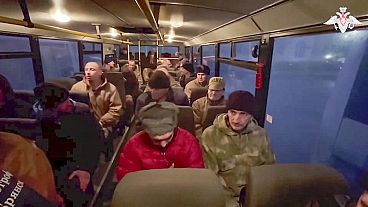 Russian soldiers sit in a bus after being released in a prisoners swap between Russia and Ukraine, at an unspecified location in Belarus, Dec 30th 2024