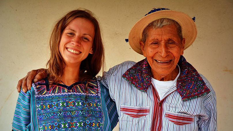Monika Lewicka smiles with a man during a hitch-hiking trip through Guatemala
