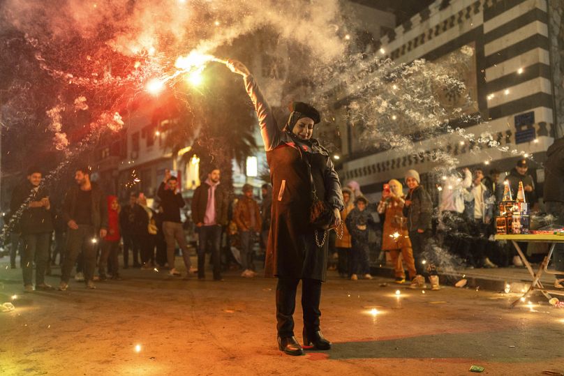 سوريون يحتفلون بالعام الجديد، في دمشق، سوريا، الثلاثاء 31 ديسمبر 2024.