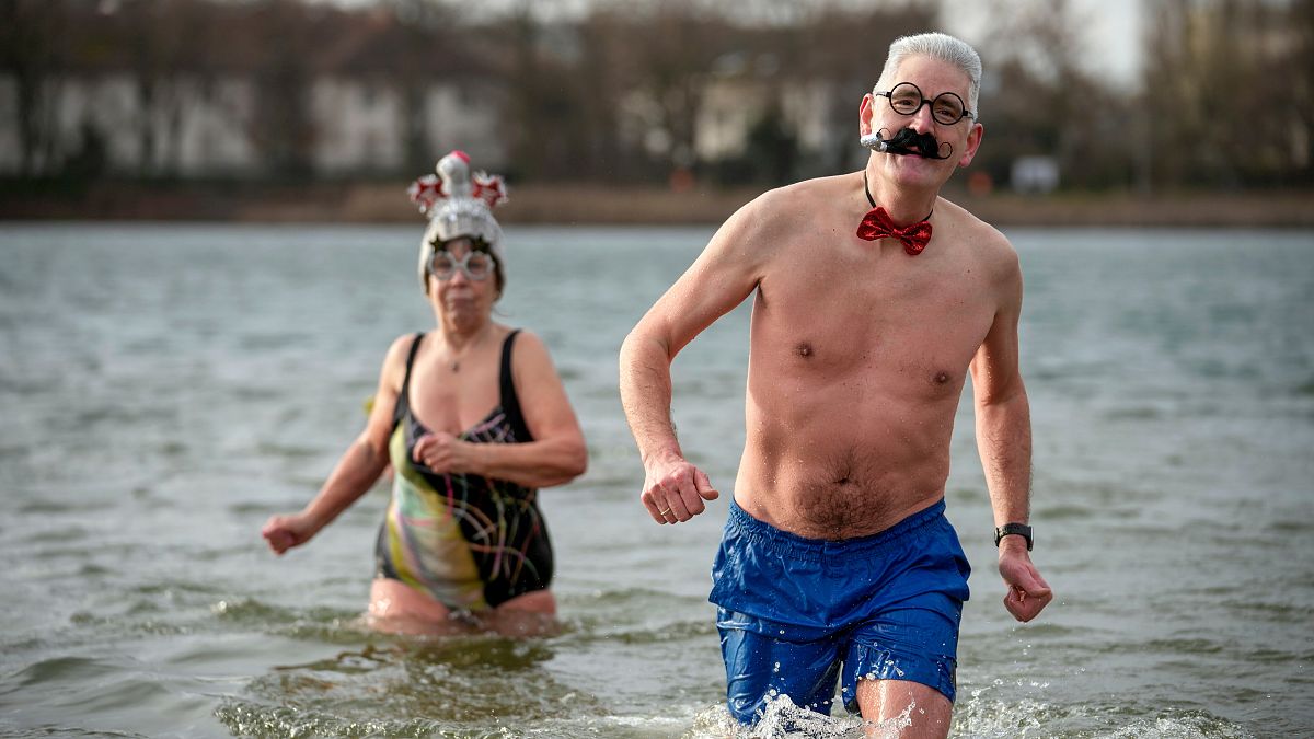 Hardy swimmers brave chilly waters with traditional New Year’s dip