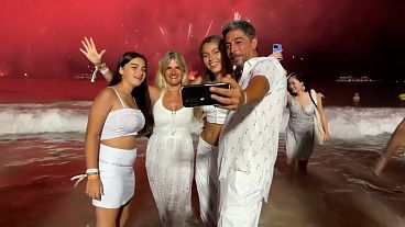 Tens of thousands cheer on Copacabana Beach as Rio welcomes new year with fireworks display Tens of thousands cheer on Copacabana Beach as Rio welcomes new year with fireworks display
