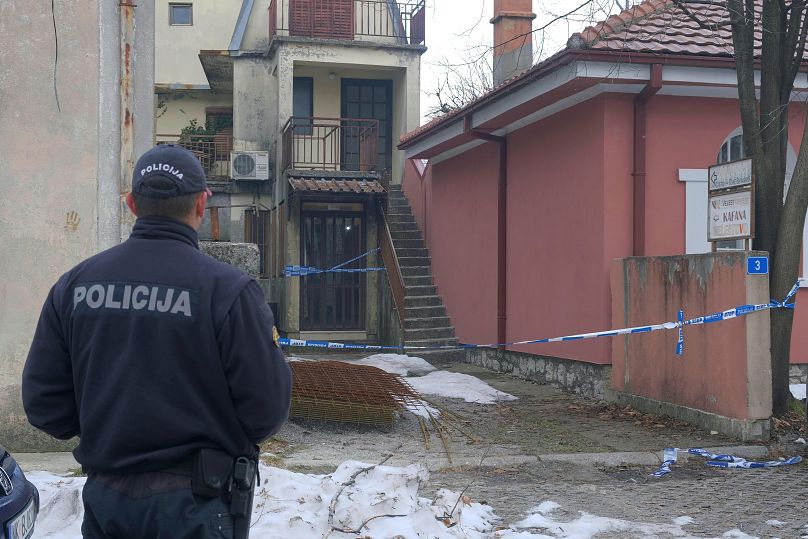 A police officer stands guard at the scene after a shooting incident at a bar in Cetinje, 2 January, 2025