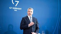 Austria's Chancellor Karl Nehammer attends a news conference with German Chancellor Olaf Scholz after a meeting at the chancellery in Berlin, Germany, Thursday, March 31, 2022