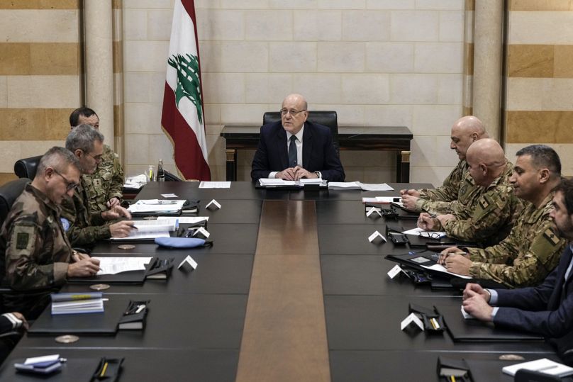Lebanese caretaker Prime Minister Najib Mikati, center, meets with the committee monitoring the Lebanon-Israel ceasefire, at the government palace in Beirut, on Dec. 24, 2024