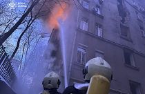 Ukranian fire fighters trying to put up a fire in a resident