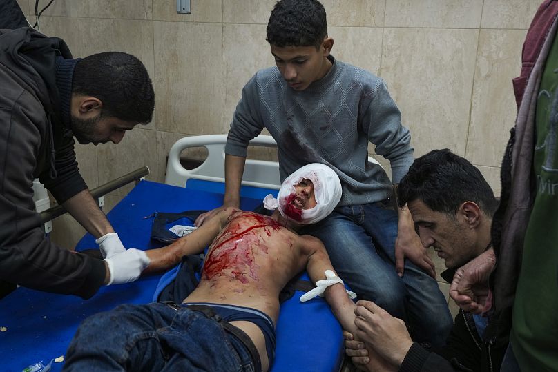 A wounded child receives treatment at Al-Aqsa Martyrs Hospital following Israeli army airstrikes in Deir al-Balah, 4 January, 2025