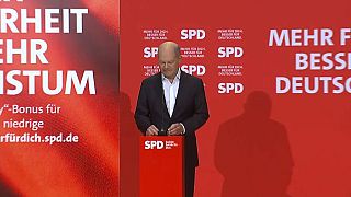 German Chancellor Olaf Scholz speaks at a press conference at the SDP HQ in Berlin, Sunday Jan. 5, 2025