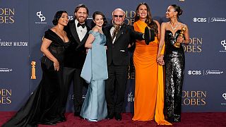 Adriana Paz, from left, Edgar Ramirez, Selena Gomez, Jacques Audiard, Karla Sofia Gascon, and Zoe Saldana with the award for best motion picture.