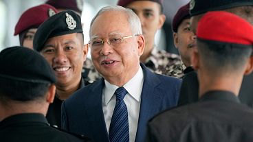Former Malaysian Prime Minister Najib Razak arrives at the Kuala Lumpur High Court complex escorted by prison officers in Kuala Lumpur, Malaysia, Thursday, 4 April 2024. 