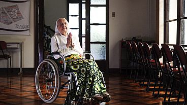 In this photo released by LongeviQuest, Sister Inah Canabarro, 115, puts her hands together in prayer, in Porto Alegre, Brazil, Friday, February 16, 2024.
