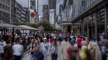 People walk in the main shopping street 'Zeil' in central Frankfurt, Germany.
