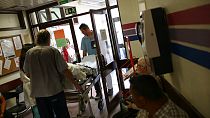 A patient is carried out on a stretcher by hospital assistants at the Sao Jose hospital during a 48-hour nurses' strike, in Lisbon, Thursday, June 4, 2015