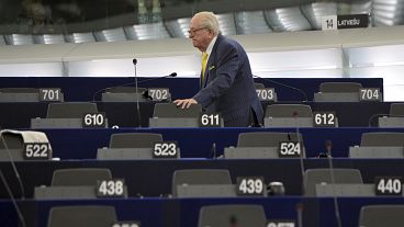 French former far right National Front leader Jean Marie Le Pen looks for his seat at the European Parliament, in Strasbourg, eastern France, July 1, 2014