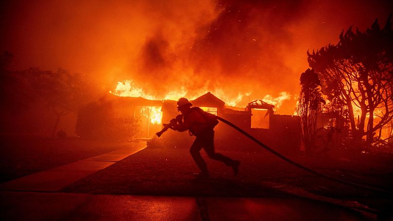 The Palisades Fire ravages a neighborhood amid high winds in the Pacific Palisades neighborhood of Los Angeles - 7 Jan 2025