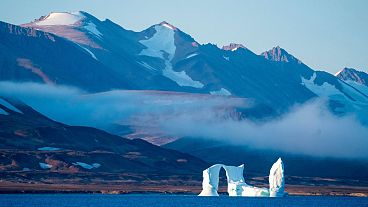 An iceberg floats in the Scoresby Sund, on 12 September 2023, in Greenland. 