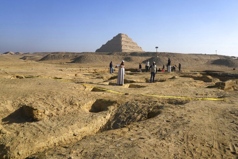 Egyptian antiquities workers dig at the site of the Step Pyramid of Djoser in Saqqara, Egypt, 26 January 2023.