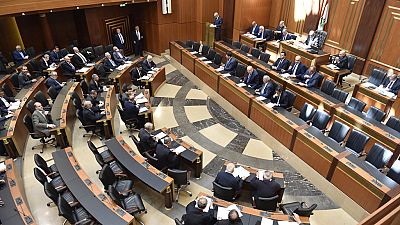 FILE - In this photo released by the Lebanese Parliament media office, Lebanese lawmakers attending a parliament session, in Beirut, Lebanon, April 18, 2023. 