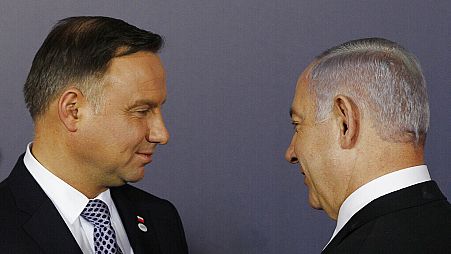 FILE: Polish President Andrzej Duda, left, and Israeli Prime Minister Benjamin Netanyahu, talk during a conference in Warsaw, Poland,  Feb. 13, 2019  