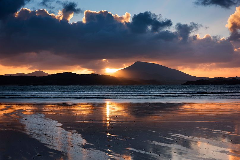 Downings Beach a short walk from The Singing Pub, a cosy inn where you can warm up by the roaring fire, with a pint of Guinness sipped beneath low-slung beams.