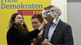 The leader of the Liberal Democrat party, Christian Lindner, is mobbed by a woman in Greifswald, Germany, 09.01.2025.