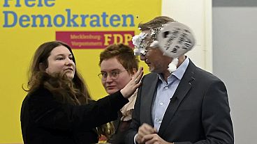 The leader of the Liberal Democrat party, Christian Lindner, is mobbed by a woman in Greifswald, Germany, 09.01.2025. The leader of the Liberal Democrat party, Christian Lindner, is mobbed by a woman in Greifswald, Germany, 09.01.2025.