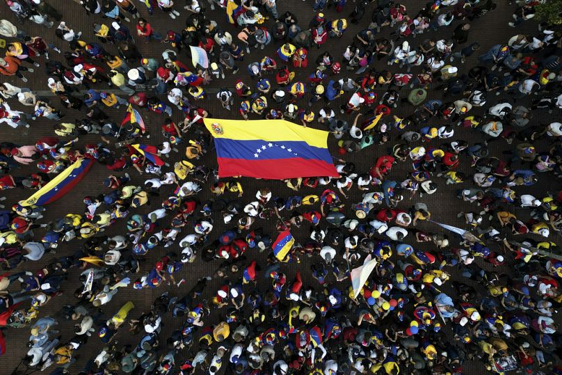 Opponents of Venezuelan President Nicolas Maduro protest the day before his inauguration for a third term in Bogota, Colombia, Thursday, Jan. 9, 2025