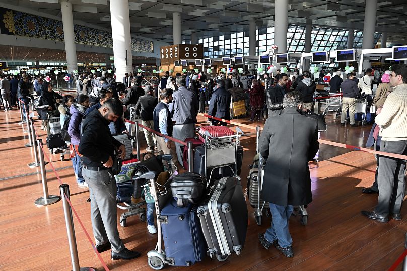 Passengers wait to board the PIA flight to Paris at Islamabad International Airport, 10 January, 2025