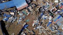 Esta vista aérea muestra viviendas destruidas en el asentamiento informal de Barakani, 21 de diciembre de 2024.