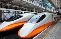 Two modern high-speed trains in a train station