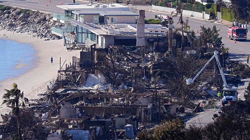 Homes along Pacific Coast Highway are seen burned and damaged while a few still stand after the Palisades Fire, Sunday, Jan. 12, 2025, in Malibu, California