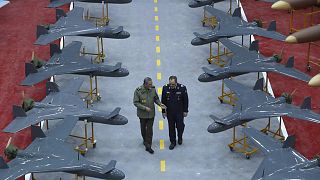 Iran's army commander Gen Abdolrahim Mousavi speaks with Defence Minister Gen Aziz Nasirzadeh in a ceremony to deliver domestically-built drones to the army, 13 January 2025