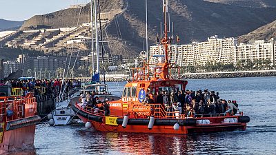 Migrants arrive on board a rescue vessel on the island of Gran Canaria, after being rescued in the Atlantic Ocean on 17 October 2020.