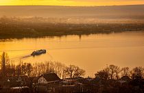 A ferry sails to the left bank of the Dniester river, the border between Moldova and Transnistria, seen from Molovata, Moldova, Wednesday, Jan. 8, 2025.