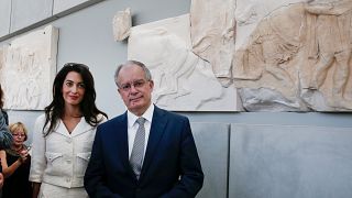 Lawyer Amal Clooney and Greek Minister of Culture and Sports Konstantinos Tasoulas, right, visit the Acropolis museum in Athens, Wednesday Oct. 15, 2014.