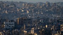 Destroyed buildings are seen inside the Gaza Strip from southern Israel, Monday, Jan. 13, 2025. 