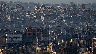 Destroyed buildings are seen inside the Gaza Strip from southern Israel, Monday, Jan. 13, 2025. 