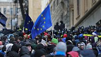 Demonstrators with EU flags rally outside the parliament to protest against the government's decision to suspend negotiations on joining the bloc in Tbilisi, Dec. 14, 2024