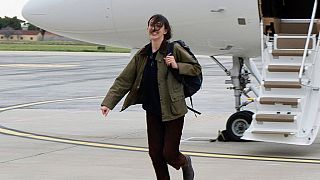 Cecilia Sala, an Italian journalist who was detained on Dec. 19 as she was reporting in Iran walks on the tarmac as she landed at Rome' Ciampino airport after being released, 