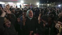 Palestinians celebrate the announcement of a ceasefire deal between Hamas and Israel in Deir al-Balah