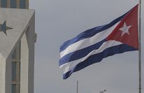 A Cuban flag flies in the wind outside the American embassy in Havana, Cuba, on 14 January, 2025.