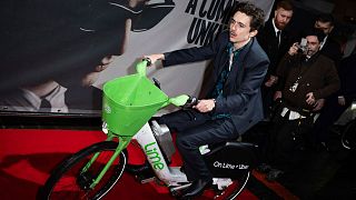 Timothée Chalamet rides an e-bike at the premiere of 'A Complete Unknown' in London