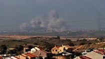 Large explosion and smoke rising over Gaza skyline 