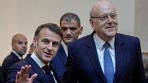 French President Emmanuel Macron after his meeting with Lebanese caretaker Prime Minister Najib Mikati, right, upon his arrival in Beirut, Friday, Jan. 17, 2025. 