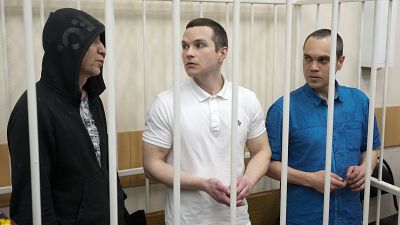 Lawyers Igor Sergunin, from left, Alexei Liptser and Vadim Kobzev, who all once represented late opposition leader Alexei Navalny, stand in a courtroom in Petushki