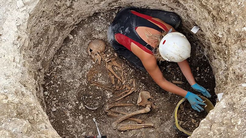 An archaeologist working on a burial site in Dorset of a young woman. 